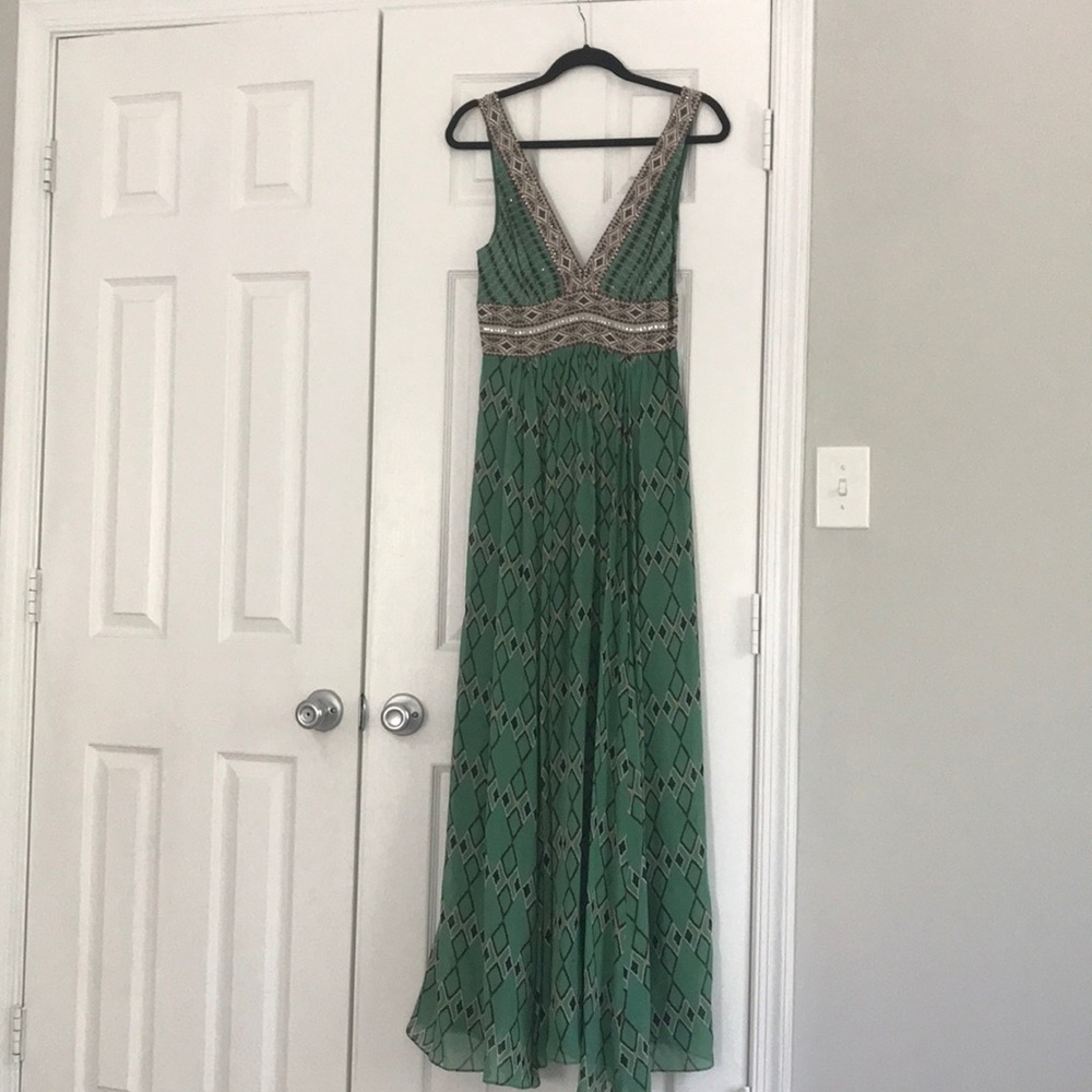 Stunning BCBG Gown with embellished v front, back
